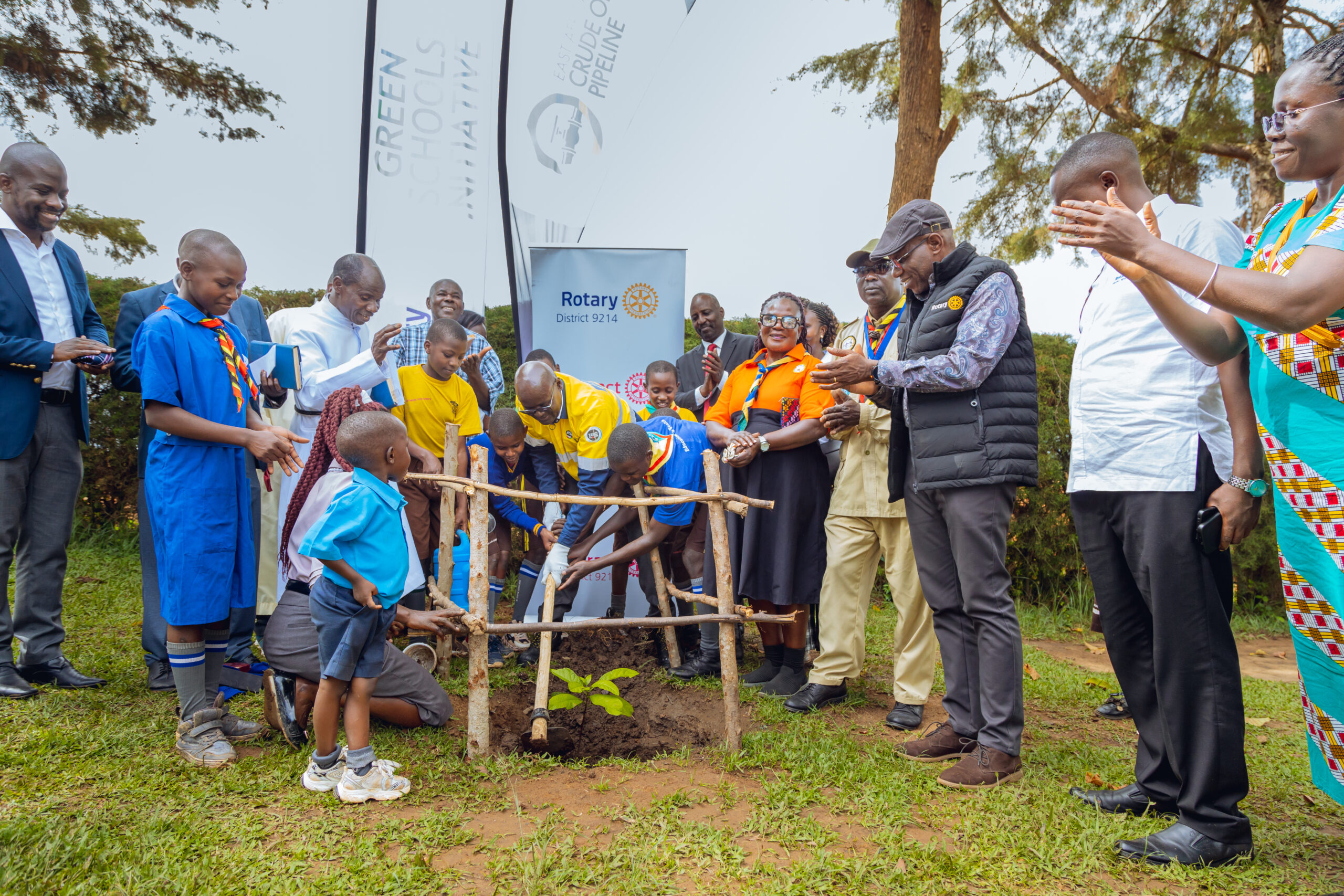 John Bosco Habumugisha, EACOP Deputy MD, joins pupils and stakeholders to plant trees at the Green Schools Initiative launch in Kyotera
